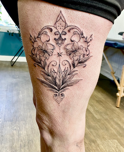 Explore family arm sleeve tattoo ideas, creative tattoo ideas in Lake City, available at Crooked Spines Tattoo Studio