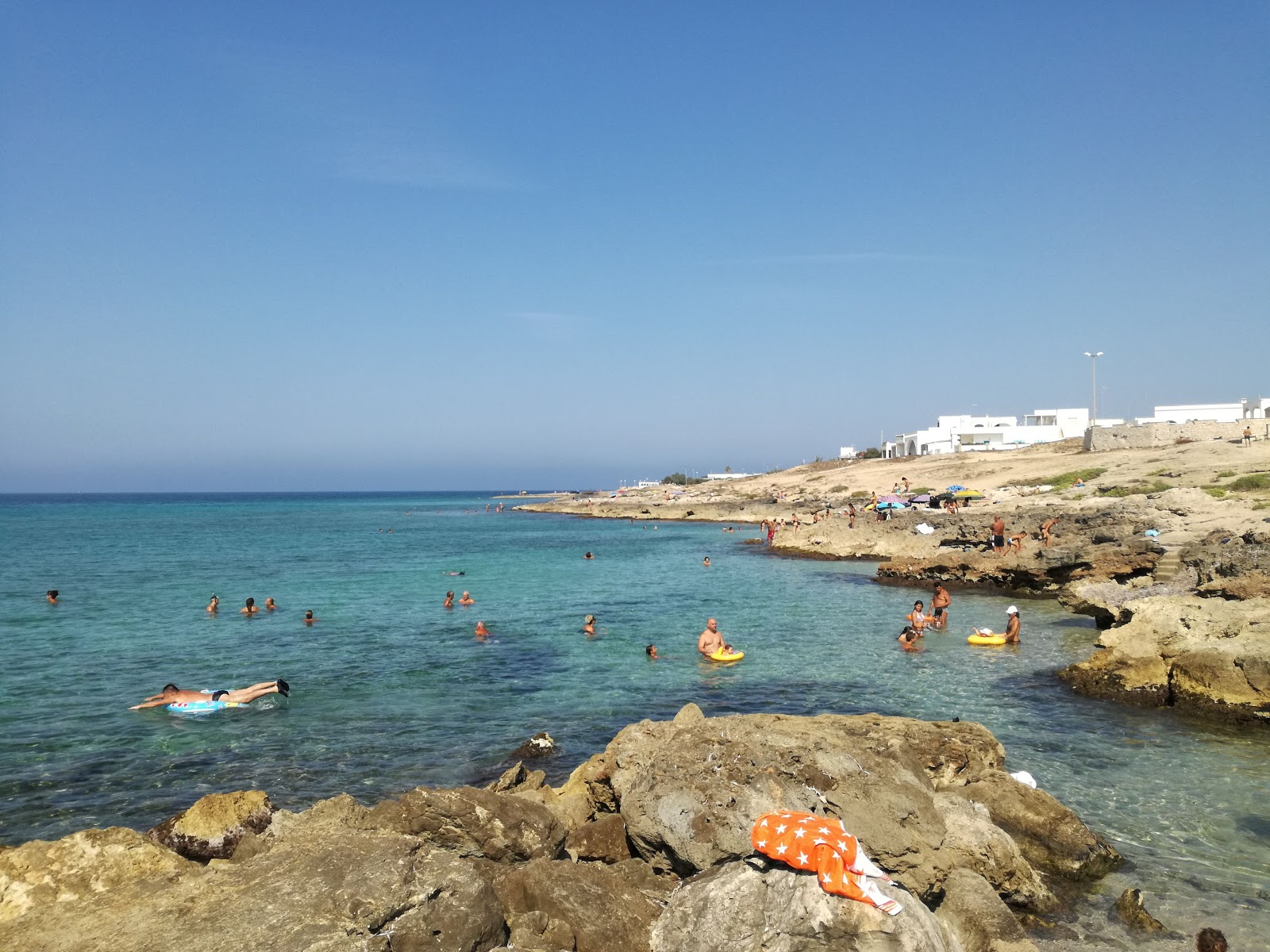 Foto av Spiaggia di Marina di Mancaversa med blå rent vatten yta