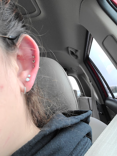 Explore cancer ribbon tattoo ideas, creative tattoo ideas in Littleton, available at Clean Slate Tattoo & Body Piercing Studio