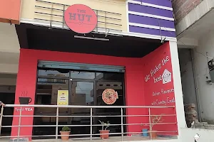The Hut pizzeria,shakes and sandwiches image