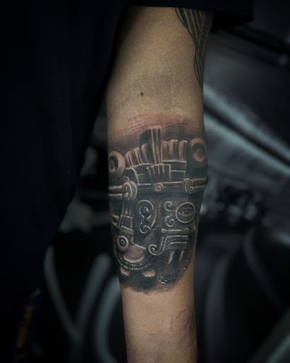 Explore sun tattoo ideas for guys, creative tattoo ideas in Astoria, available at Xolotl Tattoo Gallery