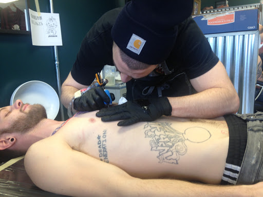 Explore dinosaur tattoo ideas for son, creative tattoo ideas in Kent, available at War Horse Ink