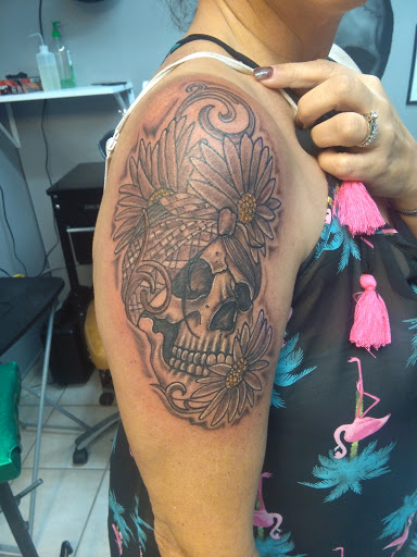 Explore flower ankle tattoo ideas, creative tattoo ideas in Bradenton, available at Memory Lane Tattoo Co.