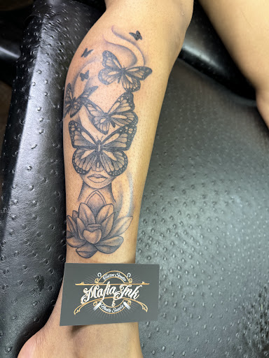 Explore wrap around tattoo ideas, creative tattoo ideas in Texarkana, available at Illusions Mafia Ink Tattoo Studio