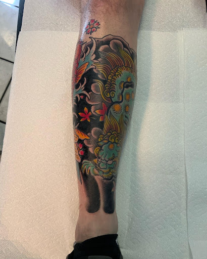 Explore dirt bike tattoo ideas, creative tattoo ideas in Orange Park, available at Fantasy Tattoo and Piercing