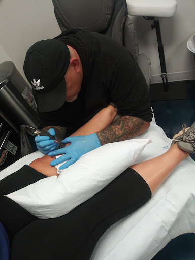 Find harley quinn and poison ivy tattoo ideas for your next unique tattoo in Buford at Inked Arts Tattoo Studio