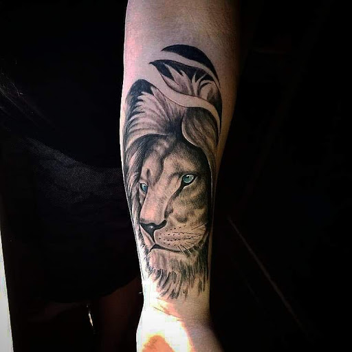 Explore forearm cross tattoo ideas, creative tattoo ideas in Mobile, available at Boujie Tattoo & Body Piercing