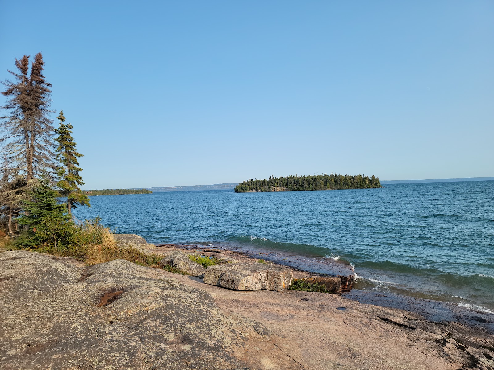 Foto av Mackenzie Point med turkos rent vatten yta