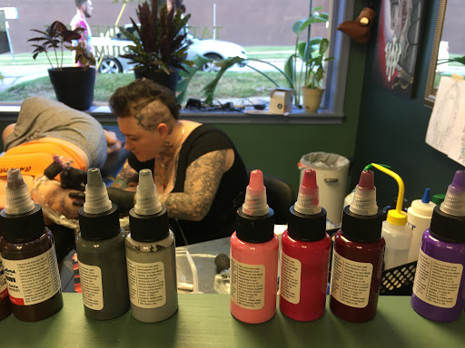 Explore snoopy tattoo ideas, creative tattoo ideas in Kent, available at War Horse Ink