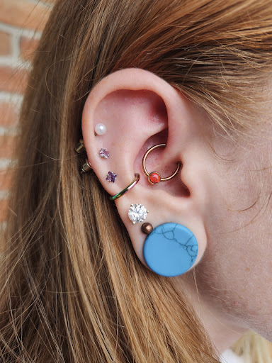 Explore mardi gras mask tattoo ideas, creative tattoo ideas in Flint, available at Origins Piercing and Tattoo