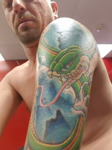 Find god tattoo ideas for your next unique tattoo in Powell at Against All Odds Tattoos and Piercings