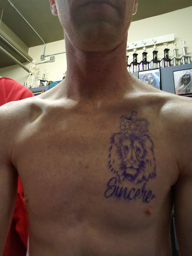 Find middle boob tattoo ideas for your next unique tattoo in Cheyenne at The T.R.I.B.E. Zoo, LLC Tattoo