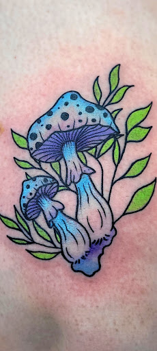 Explore upper arm tattoo ideas for females, creative tattoo ideas in Benton, available at Spectrum Tattoo