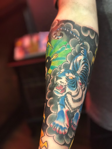 Explore tribal dragon tattoo ideas, creative tattoo ideas in Dallas, available at Legacy Arts Tattoo 2