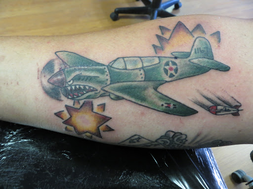 Explore chest and neck tattoo ideas, creative tattoo ideas in Powell, available at AVALON COVE TATTOO