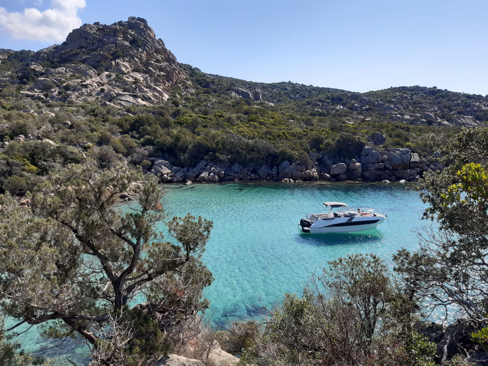 Photo of Cala Longa beach with turquoise pure water surface