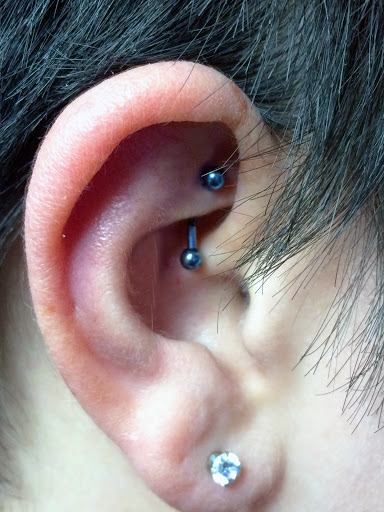 Explore lower arm tattoos ideas for guys, creative tattoo ideas in Edgewood, available at Evolved Body Arts