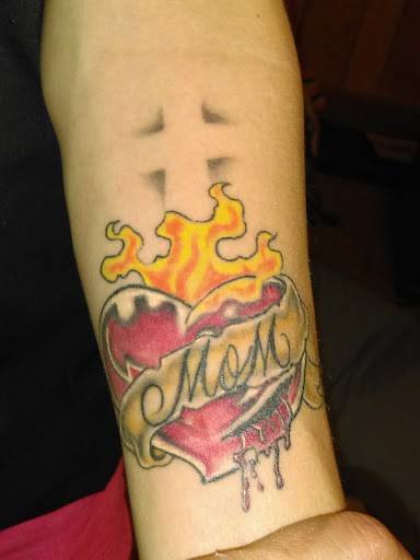 Find christmas tattoo ideas for your next unique tattoo in Harriman at Tattoos By Bryan