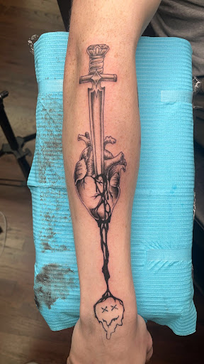 Explore alien tattoo ideas, creative tattoo ideas in The Colony, available at Lizards Ink Tattoo and Piercing