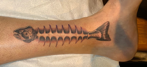 Explore red hand tattoo ideas, creative tattoo ideas in Scottsdale, available at Club Tattoo