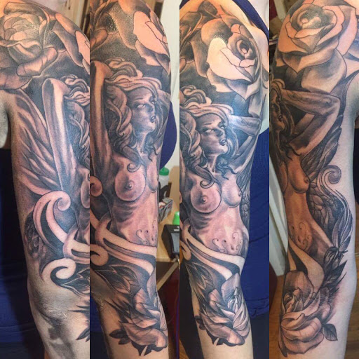 Find in between breast tattoo ideas for your next unique tattoo in Milford at Golden Hammer Tattoo Studios