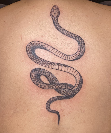 Explore female neck tattoo ideas, creative tattoo ideas in Rogers, available at Frisco Tattoo