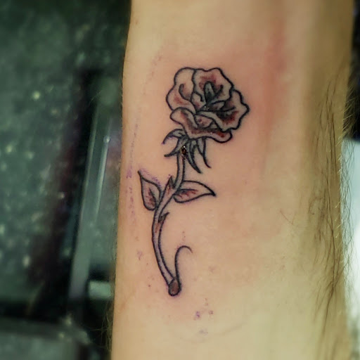 Explore rose vine tattoo ideas, creative tattoo ideas in Milwaukee, available at Bay Street Tattoo Co.