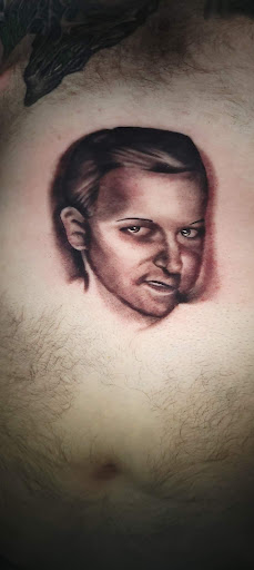 Explore gore tattoo ideas, creative tattoo ideas in Angola, available at Hoodlum Ink