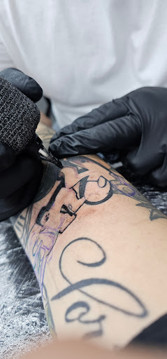 Explore rockstar tattoo ideas, creative tattoo ideas in Apple Valley, available at Saints X Sinners Tattoo