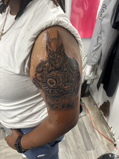 Explore blackout tattoo ideas, creative tattoo ideas in Mattapan, available at Famous Touch Tattoos