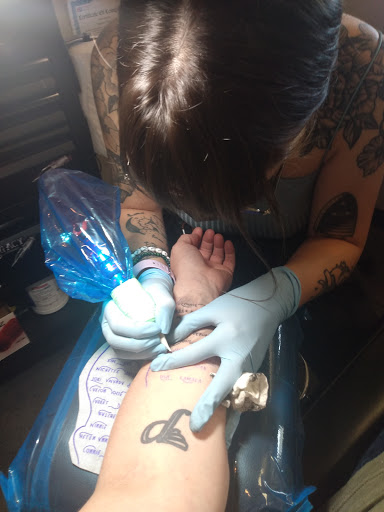 Explore black heart heart tattoo cover up ideas, creative tattoo ideas in Edmond, available at 15th Legion Tattoo & Body Piercing