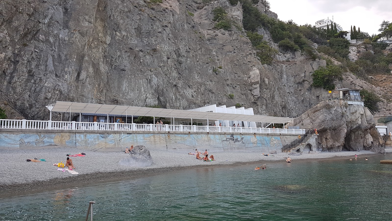 Photo of Parus hotel beach backed by cliffs