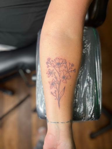 Explore jawline tattoo ideas, creative tattoo ideas in Foley, available at Emerald Ink Tattoos by Victoria