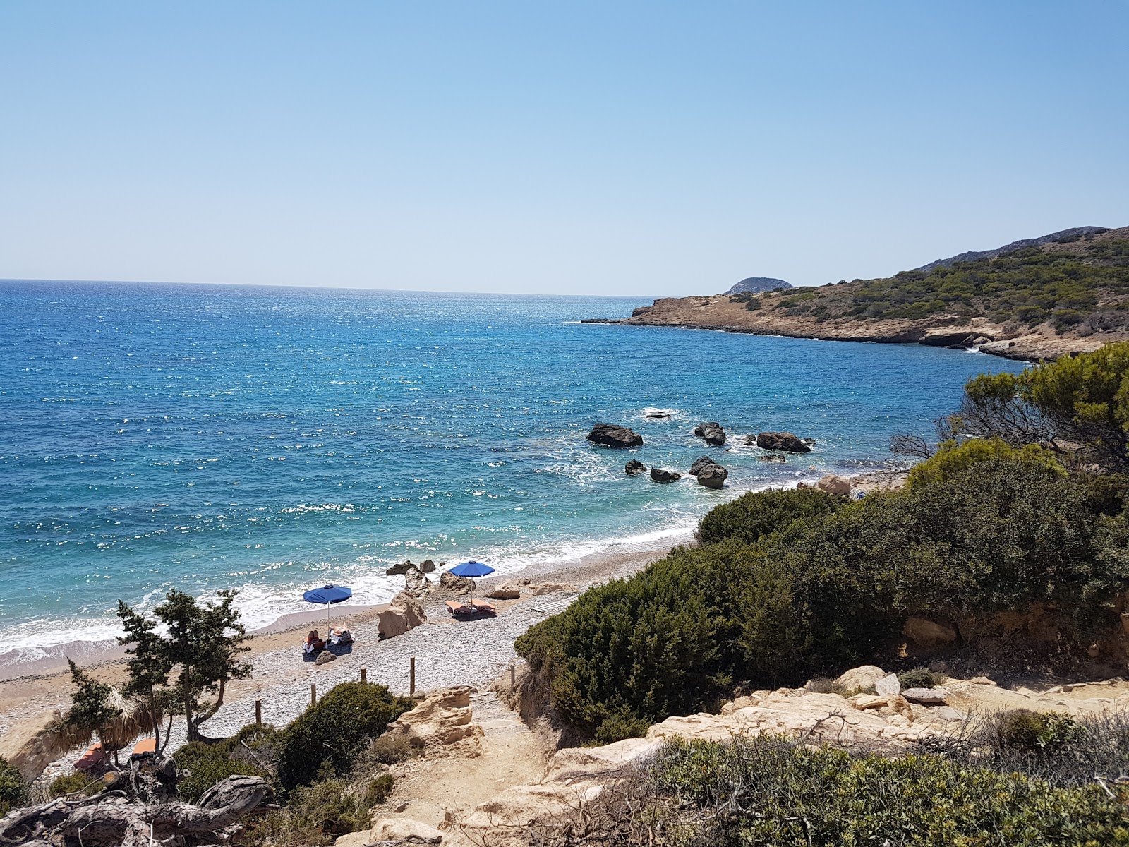 Photo of Alyki Beach with blue pure water surface