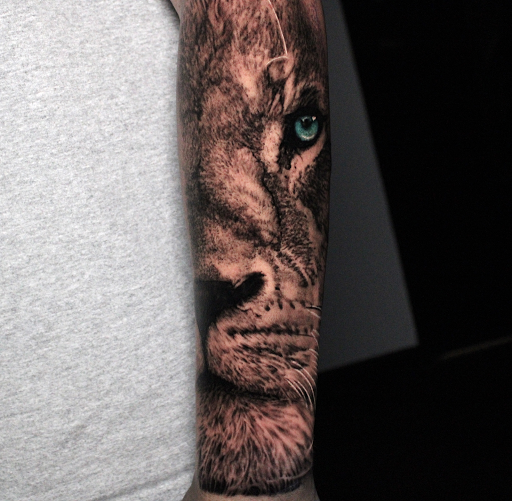 Explore mens inner bicep tattoo ideas, creative tattoo ideas in Addison, available at Cat Tattoo