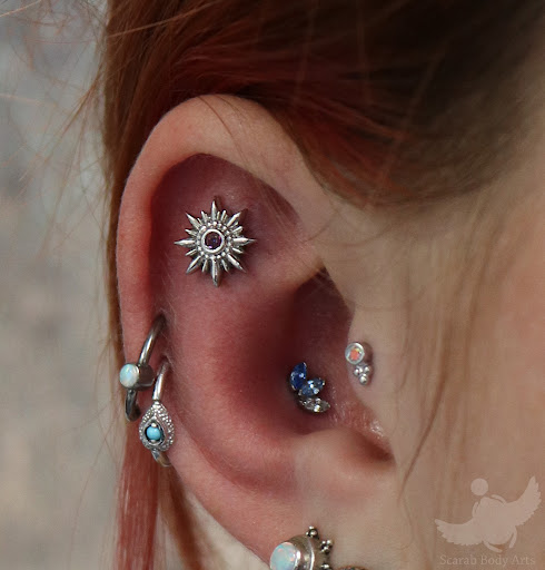 Explore sewing tattoo ideas, creative tattoo ideas in Syracuse, available at Scarab Body Arts