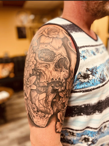 Explore male bicep tattoo ideas, creative tattoo ideas in Warner Robins, available at Untold Pain Tattoo Studio