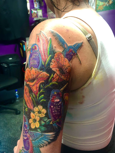 Explore olive branch tattoo ideas, creative tattoo ideas in New Port Richey, available at Zodiac Tattooing & Body Piercing