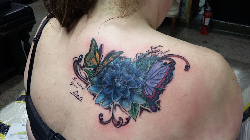 Explore thigh tattoos ideas for guys, creative tattoo ideas in Rockford, available at House Of Pain Tattoo co.