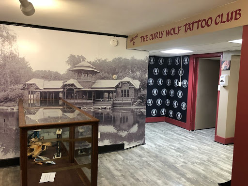 Explore women thigh tattoo ideas, creative tattoo ideas in Albany, available at The Curly Wolf Tattoo Club