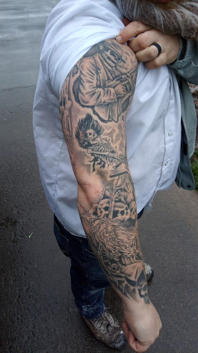 Explore graveyard tattoo ideas, creative tattoo ideas in Calhoun, available at Immortal Tattoos