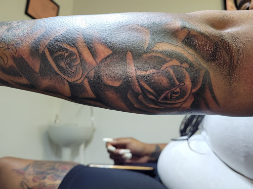 Explore small tattoo placement ideas, creative tattoo ideas in Angola, available at Hoodlum Ink