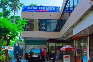 Real Homes Rooms changanacherry a/c non a/c rooms. image