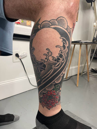 Explore mens knee tattoo ideas, creative tattoo ideas in Chapel Hill, available at Golden Falcon Tattoo and Piercing