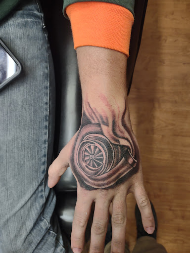 Find best travel tattoo ideas for your next unique tattoo in Williamston at Inkd Tattoo Parlor