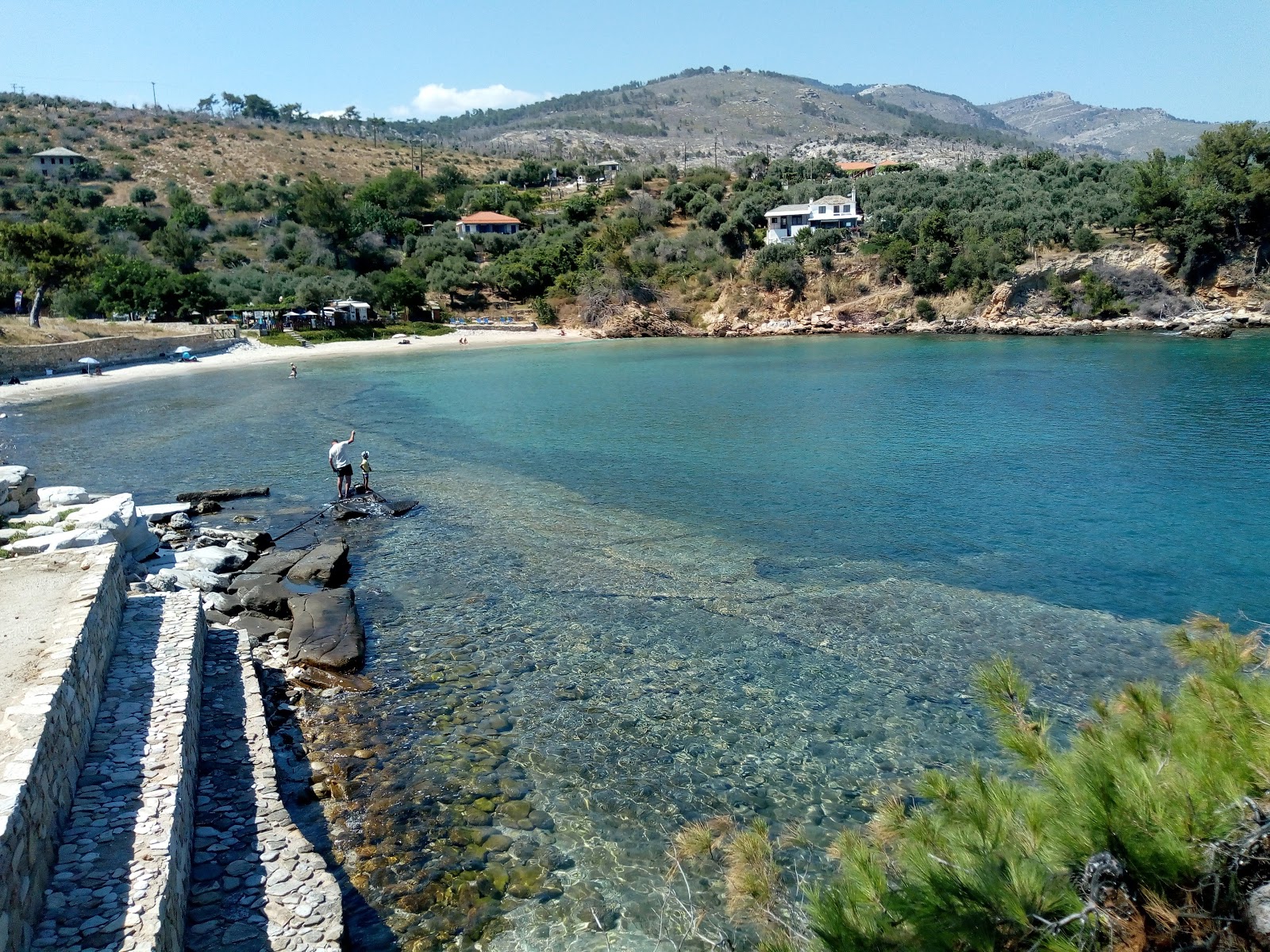 Fotografie cu Ancient Aliki cu o suprafață de nisip beige