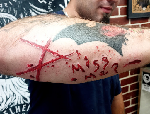 Explore skull neck tattoo ideas, creative tattoo ideas in West Coxsackie, available at The Hall of Ravens