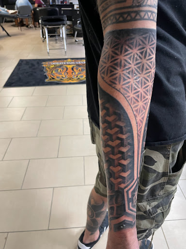 Explore hand tattoos ideas for men, creative tattoo ideas in Sarasota, available at SEVEN SINS Tattoo Studio