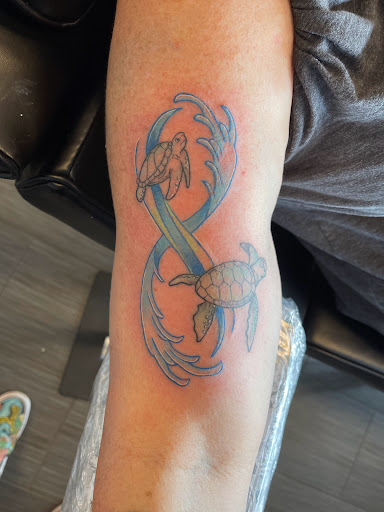 Explore graduation cap tattoo ideas, creative tattoo ideas in Palm Harbor, available at Angry Owl Tattoo and Piercing