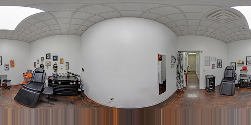 Explore arm tribal tattoo cover up ideas, creative tattoo ideas in Wisconsin Dells, available at Twisted Dimensions Tattoo Studio